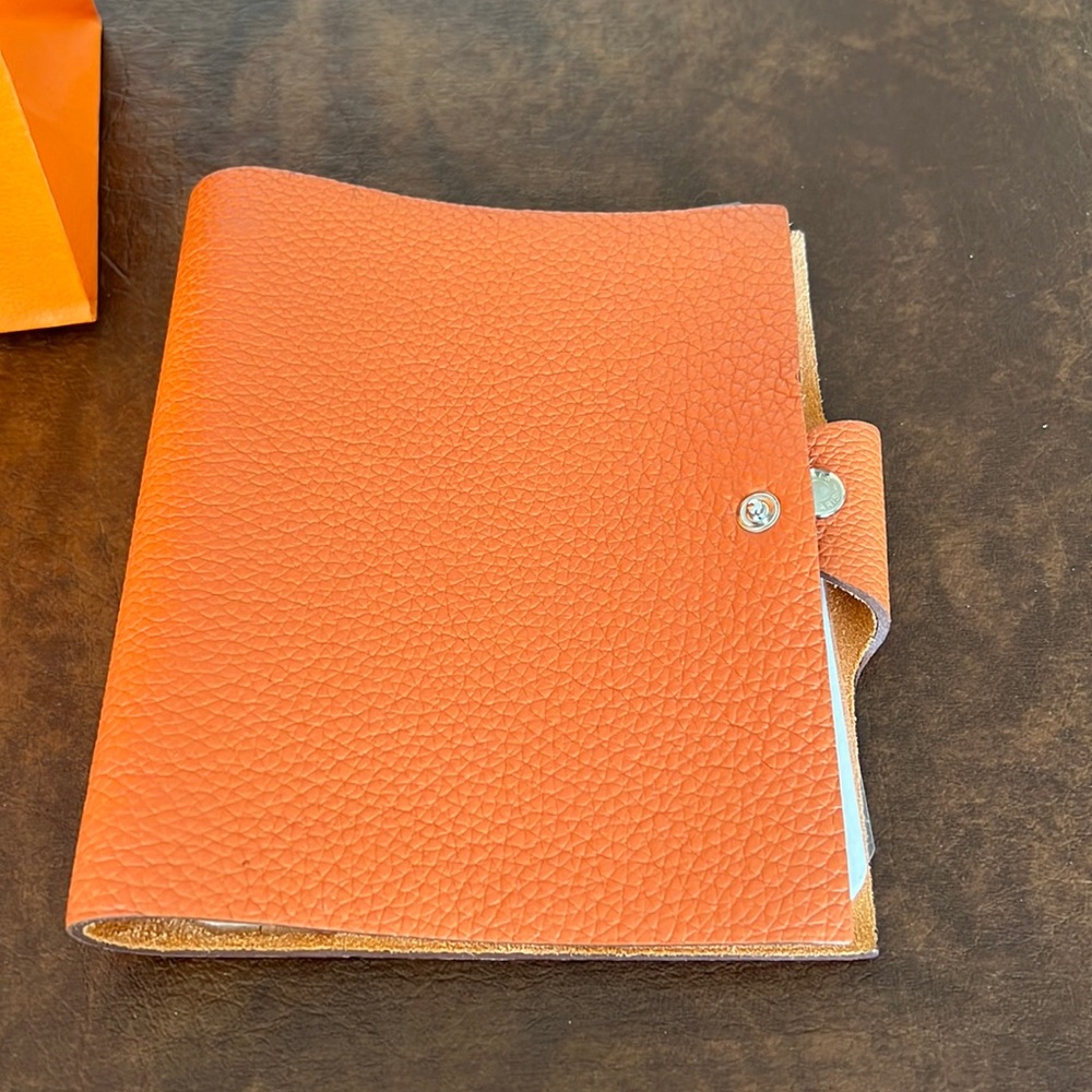 Hermes Ulysse Orange PM notebook.